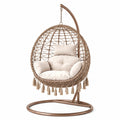 Sedia sospesa in rattan e acciaio con cuscini in poliestere beige